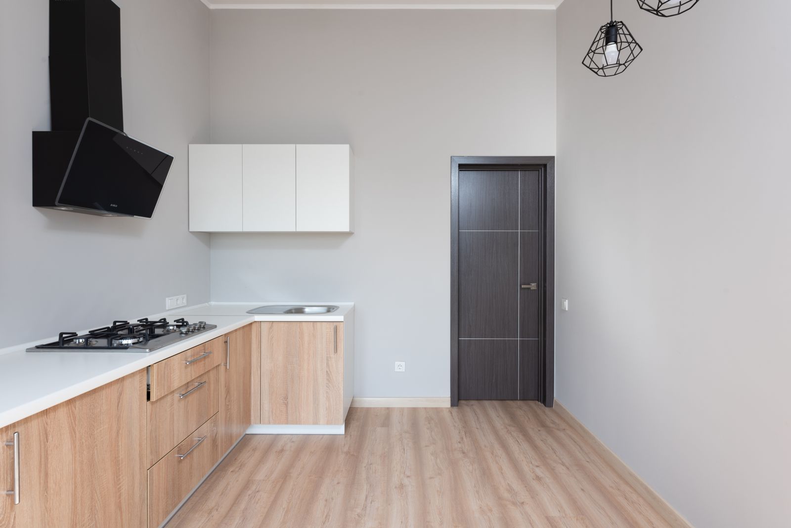 Timber-finish kitchen cabinetry with a light worktop