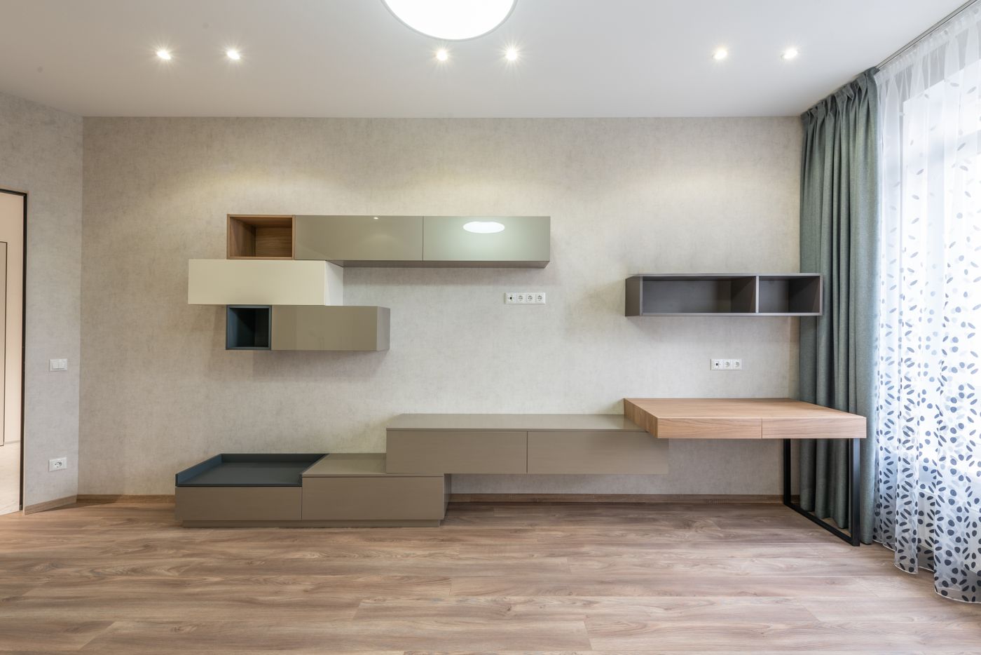 Living space with cabinetry and open shelving
