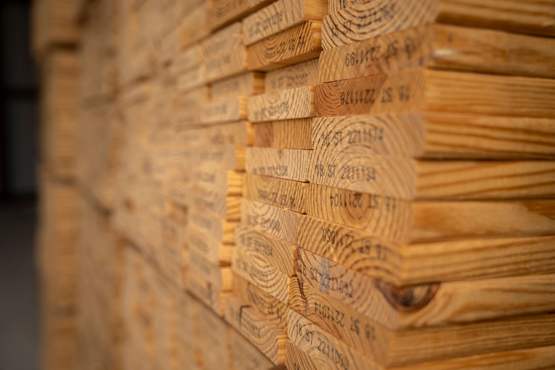 Stacked timber showing sawn ends and natural grain